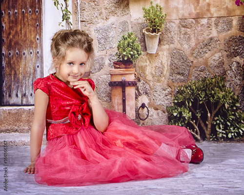 little girl in a red dress