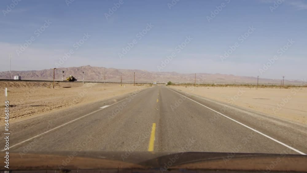 Driving on open road in desert, POV Driving on open road in desert, POV