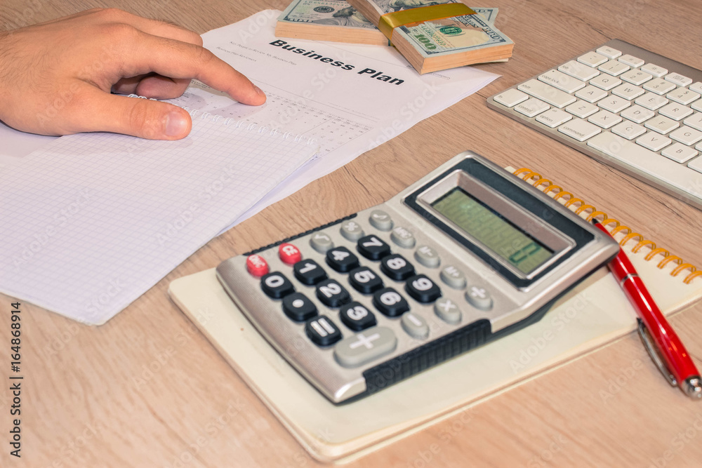 View of bookkeeper or financial inspector hands making report, c View of bookkeeper or financial inspector hands making report, c