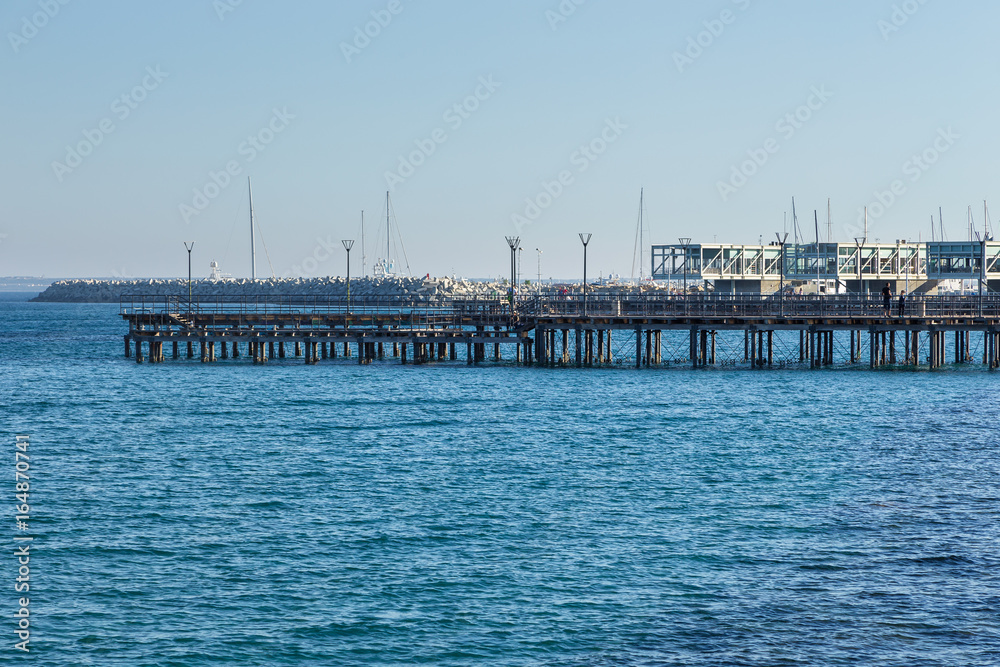 Promenade street and pier in the city Limassol, begin of the summer season. Cyprus

