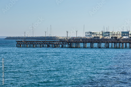 Promenade street and pier in the city Limassol, begin of the summer season. Cyprus 