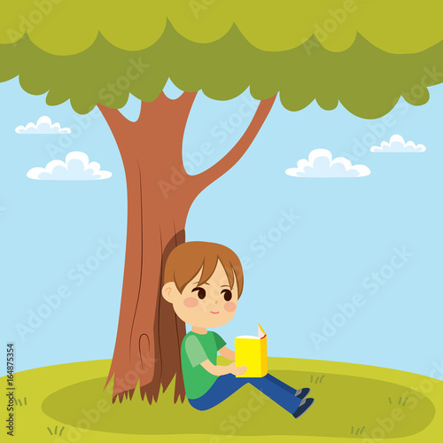 Young little kid reading a ...
