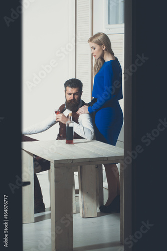Girl standing at man drinking wine © Volodymyr