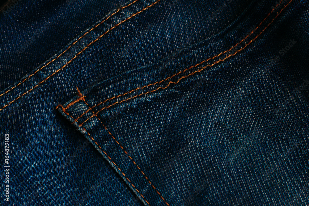 Blue denim texture with stitching. Jeans texture. Macro photo. Close up. Blue denim texture with stitching. Jeans texture. Macro photo. Close up.