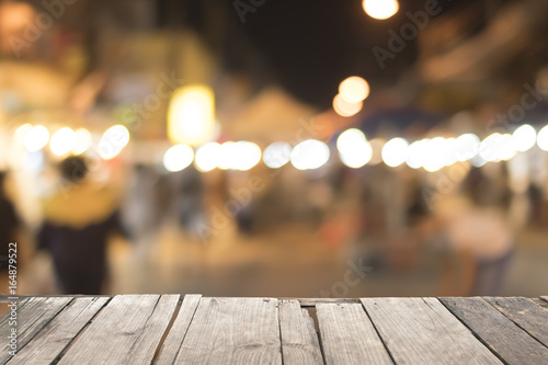 Old wooden on font and blurred night street background. abstract. photo