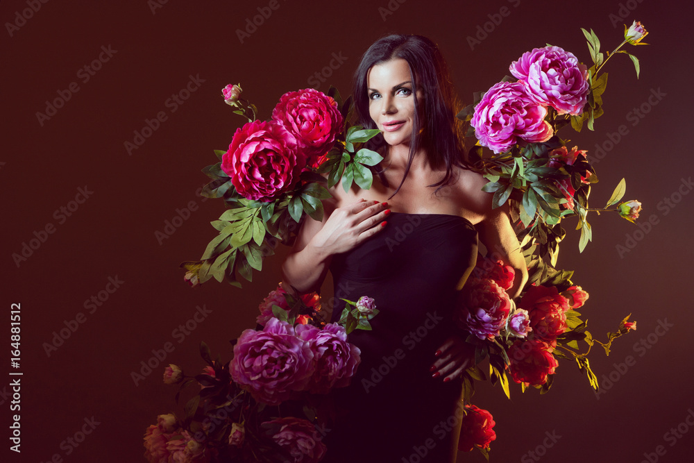 Girl surrounded by flowers.