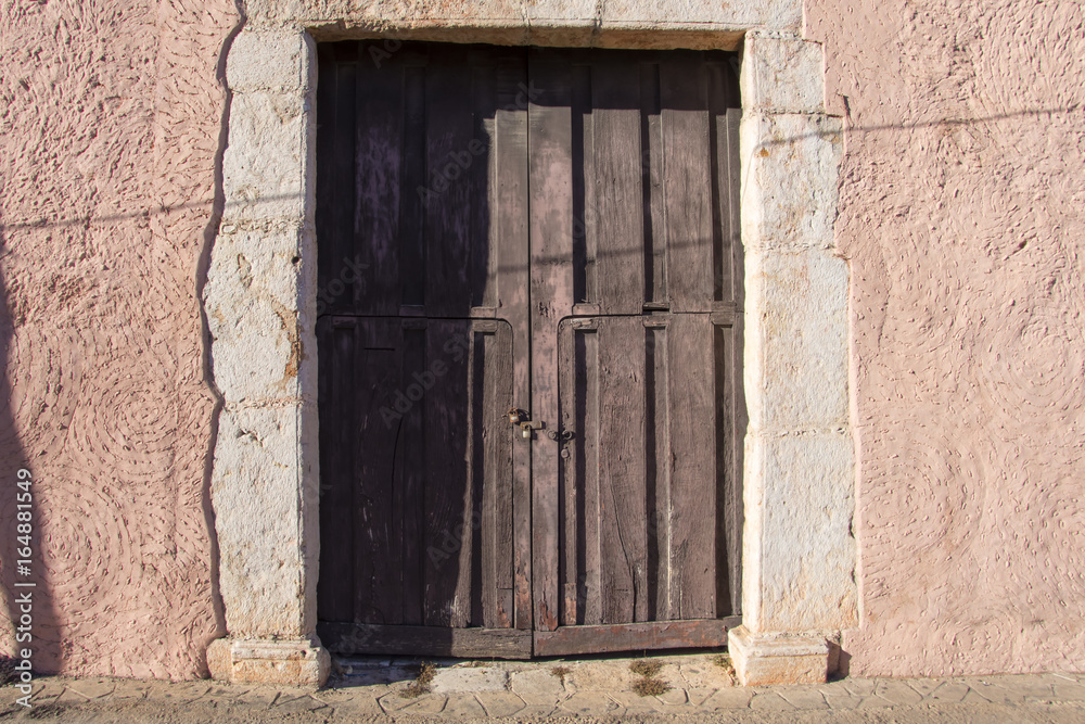 Old rustic colonial door and wall