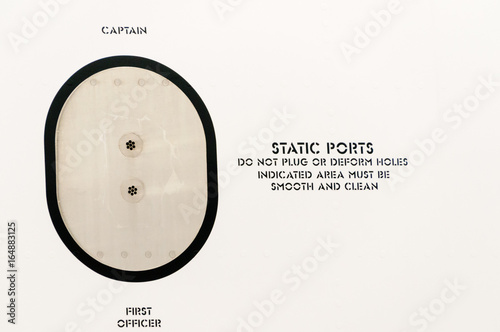 Static vents ports on the side of the fusilage of a Boeing 737. photo