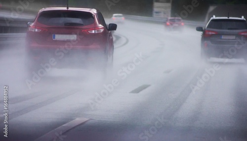 Εκτύπωση καμβά Cars driving on wet rainy road in bad weather