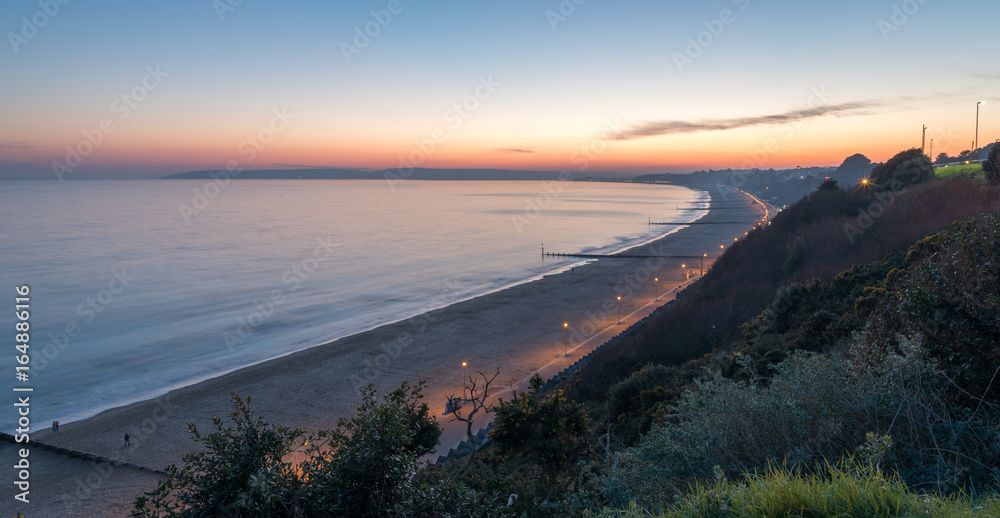 Sun setting over Bournemouth beach