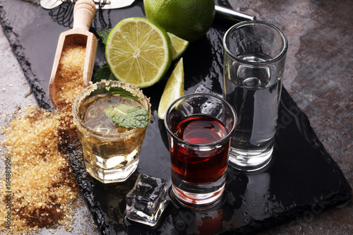 Selection of alcoholic drinks on rustic stone plate