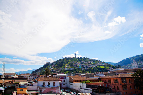 Beautiful view of Quito mixing new architecture with charming streets, with a panecillo turist place in the mountain in front, in the city of Quito