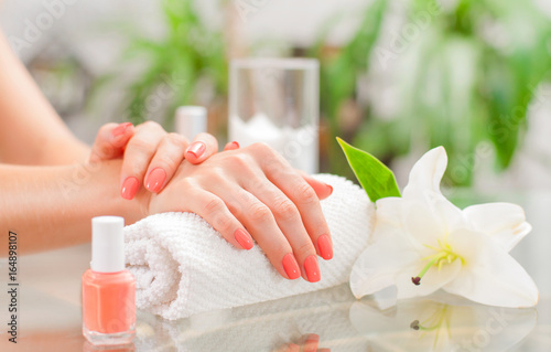 Manicure concept. Beautiful woman s hands with perfect manicure at  beauty salon.
