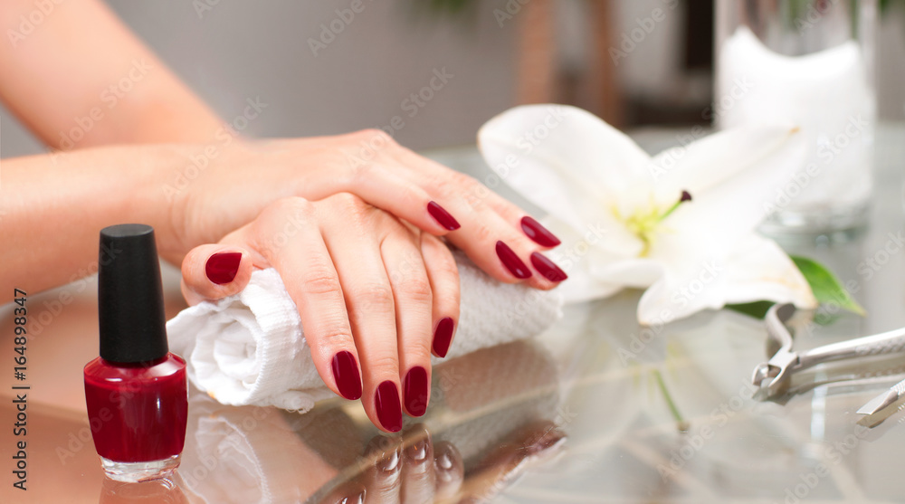 Manicure concept. Beautiful woman's hands with perfect manicure at  beauty salon. - obrazy, fototapety, plakaty 