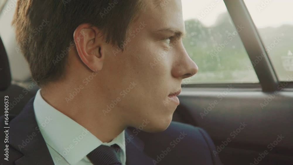 Portrait of handsome sad businessman in the car 4K Portrait of handsome sad businessman in the car 4K