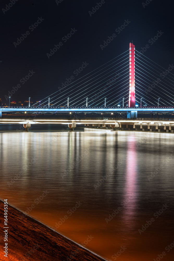 Naklejka premium Illuminated City At Waterfront in city of China.