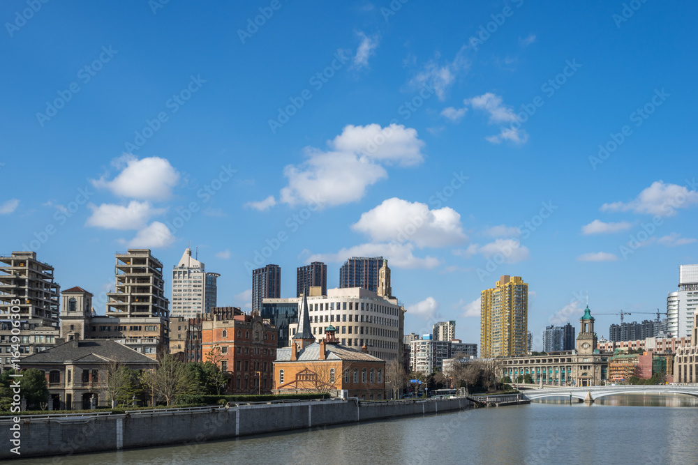 River And Modern Buildings Against Sky in city of China.