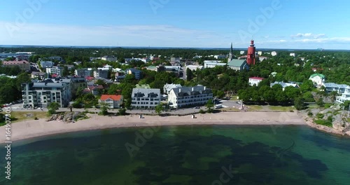 Hanko, Cinema 4k aerial view towards hanko cityscape and bulevardi beach, on Hango regatta day, in Uusimaa, Finland photo