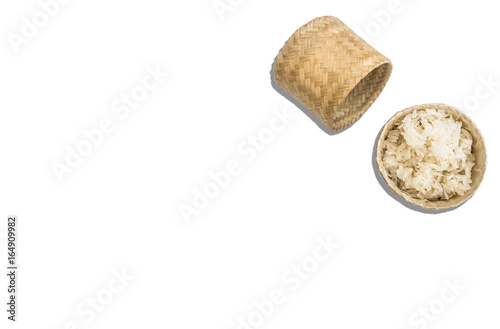 Streamed sticky rice in wicker basket isolated on white background.