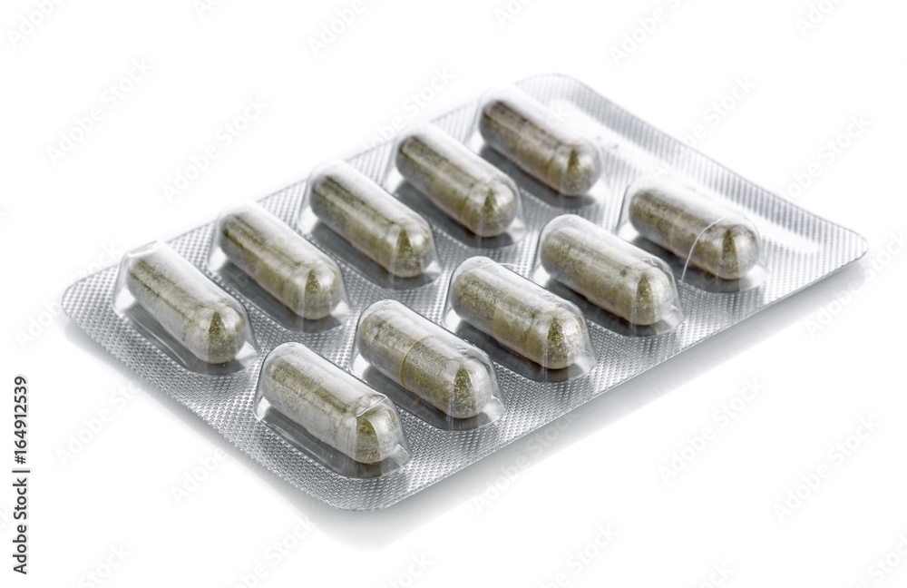 Medicine panel of green capsule isolated on white Medicine panel of green capsule isolated on white