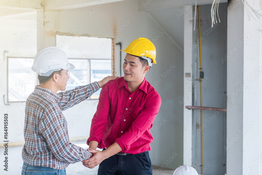 Portrait of engineer checking the job and talking about project with commitment to success at construction site