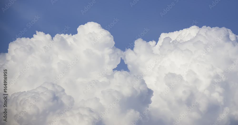 Kissing Cloud-- Panorama dramatic atmosphere view of clouds look like perform kissing each other on blue sky background. Kissing Cloud-- Panorama dramatic atmosphere view of clouds look like perform kissing each other on blue sky background.