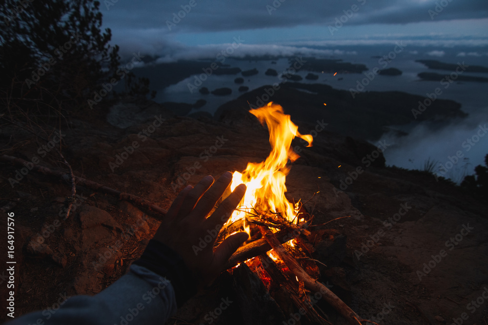 Enjoying view from top with campfire and islands in the front