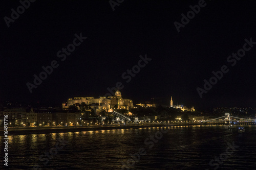 Night Budapest at the river Danube. Buda Castle (Royal Palace) and Chain bridge (Szechenyi lanchid) on background. Hungary © FedBul