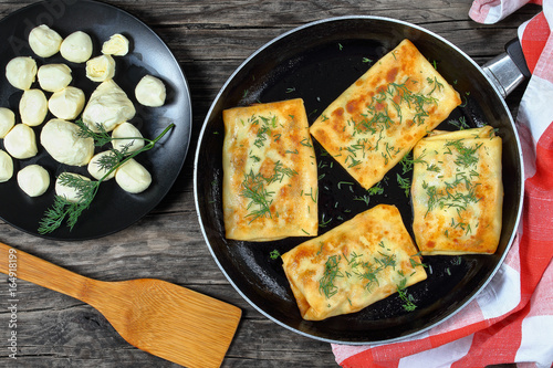 tasty cheese spinach stuffed crepes wraps photo