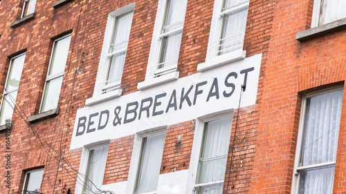 Dublin, Ireland, Bed and Breakfast panel on a brick wall 
