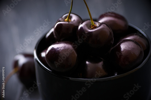 Cherries in black bowl