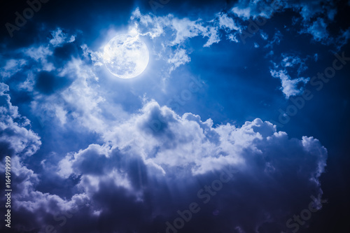 Night landscape of sky with cloudy and bright full moon with shiny.