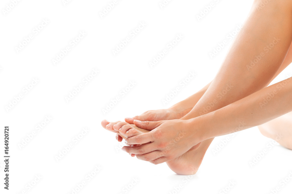 Beautiful women feet isolated on white close-up Beautiful women feet isolated on white close-up
