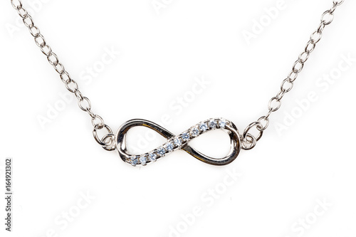 Silver infinity pendant with blue diamonds