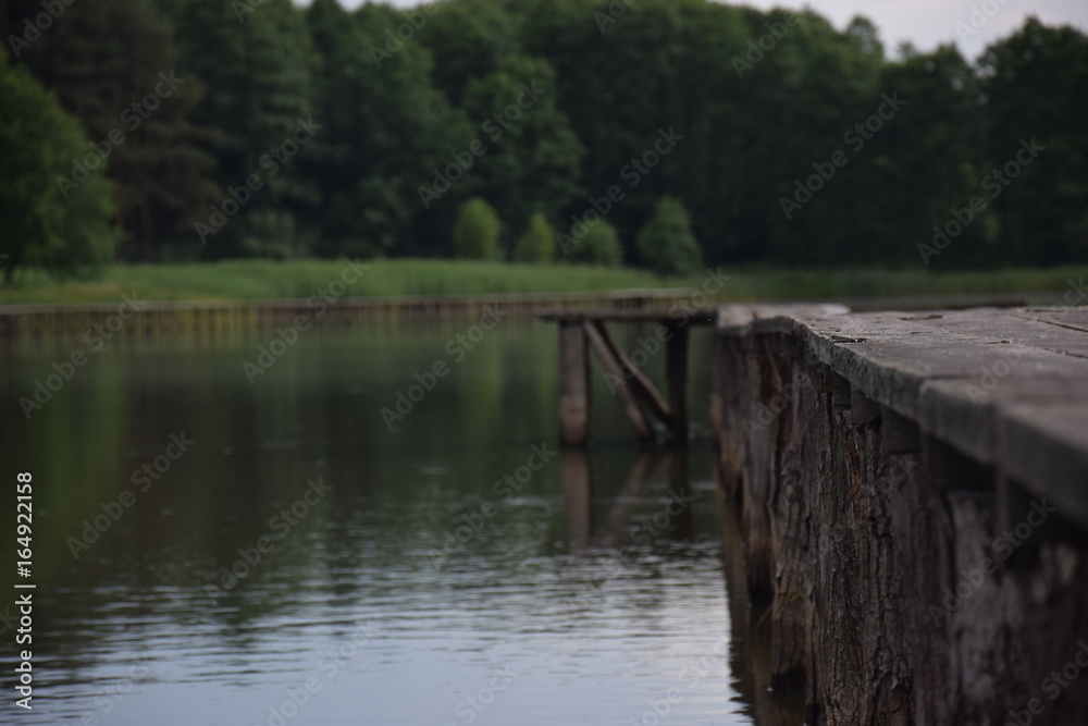 wooden pier in the middle of lake