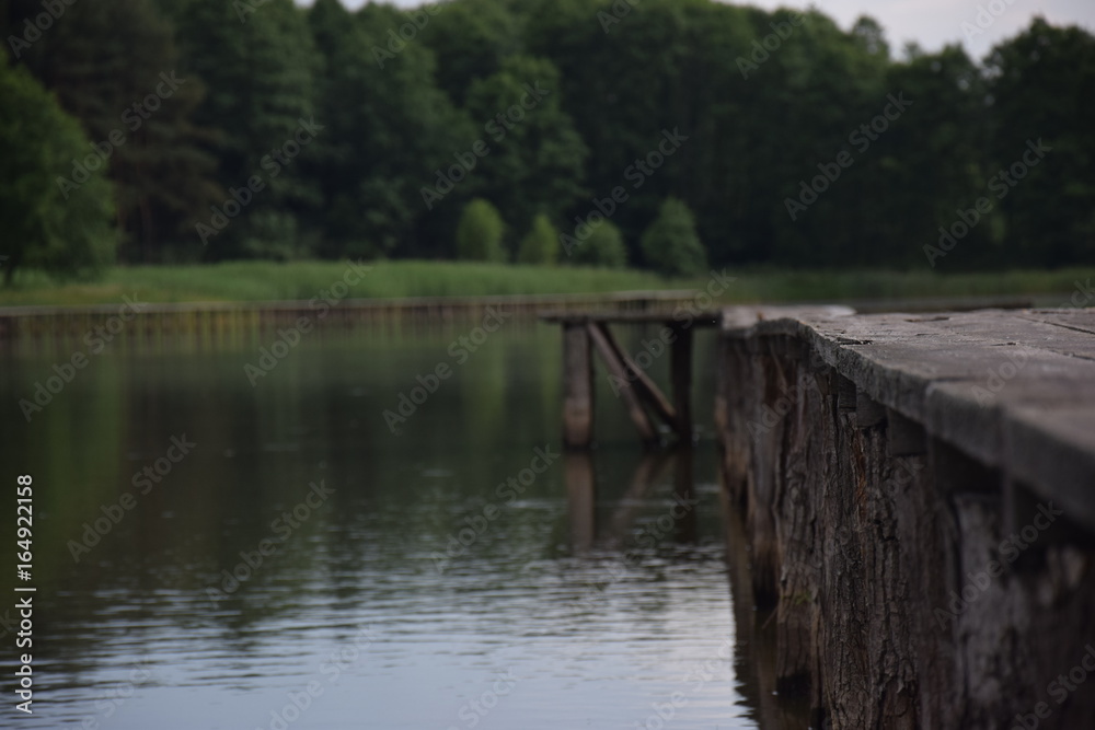 wooden pier in the middle of lake wooden pier in the middle of lake