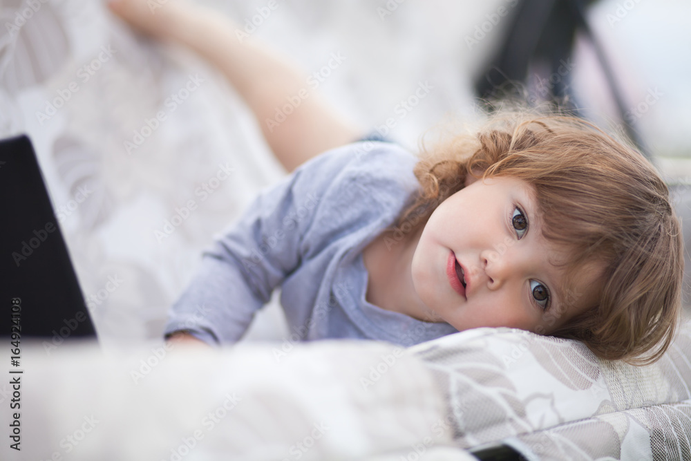 Fototapeta premium Adorable toddler girl poses like a model