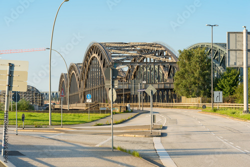 The truss bridge, in German,Freihafenelbebruecke, is crossing the Elbe river at the east end of the harbor and is the link from the former free port to the industrial harbor area photo