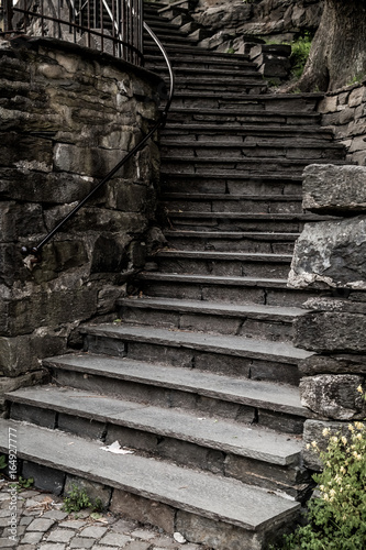 Grungy stone stairs leading a way down