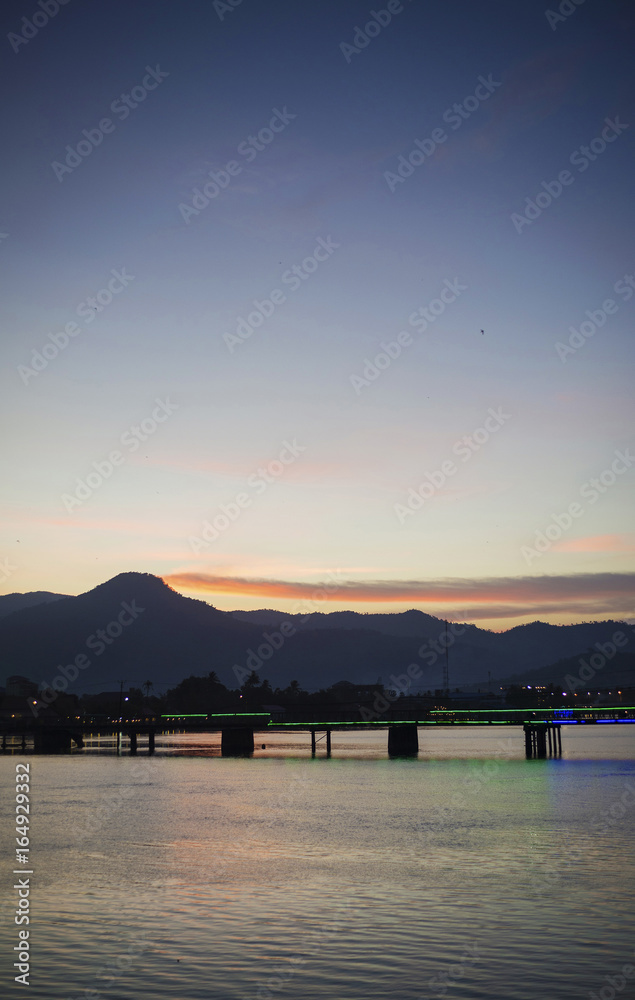 Fototapeta premium view of old bridge in kampot town cambodia at sunset