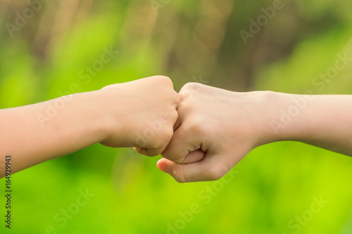 Two hands hitting each other with their fists © watman