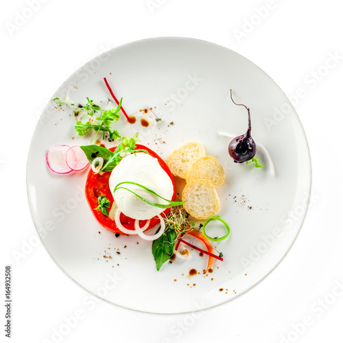 Fotografie Delicious Italian caprese on a rustic wooden table
