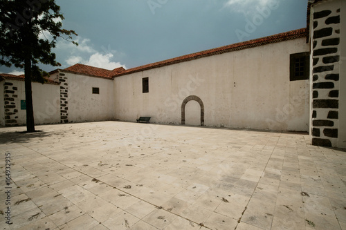 loneley and empty square in spain with blue sky photo