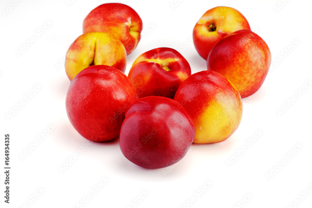 Group of whole nectarine fruits isolated on white background Group of whole nectarine fruits isolated on white background