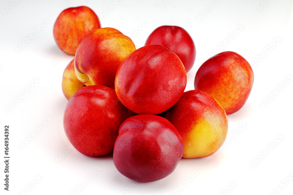 Group of whole nectarine fruits isolated on white background Group of whole nectarine fruits isolated on white background