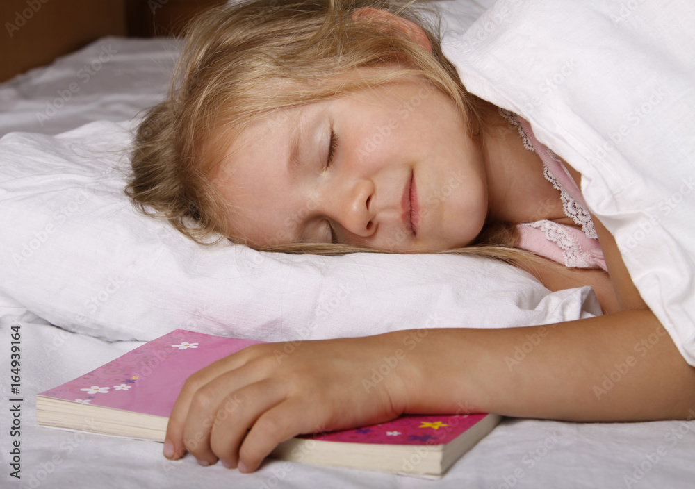 Adorable little girl sleeping in the bed Adorable little girl sleeping in the bed