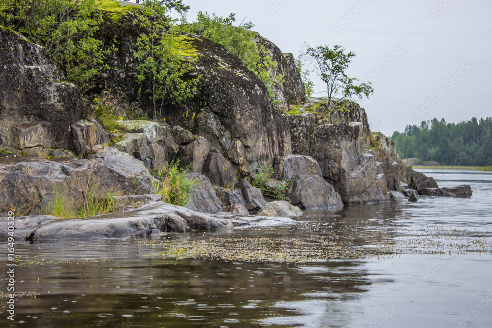 Stones, rocks in Lake Ladoga, Republic of Karelia, Russia Stones, rocks in Lake Ladoga, Republic of Karelia, Russia