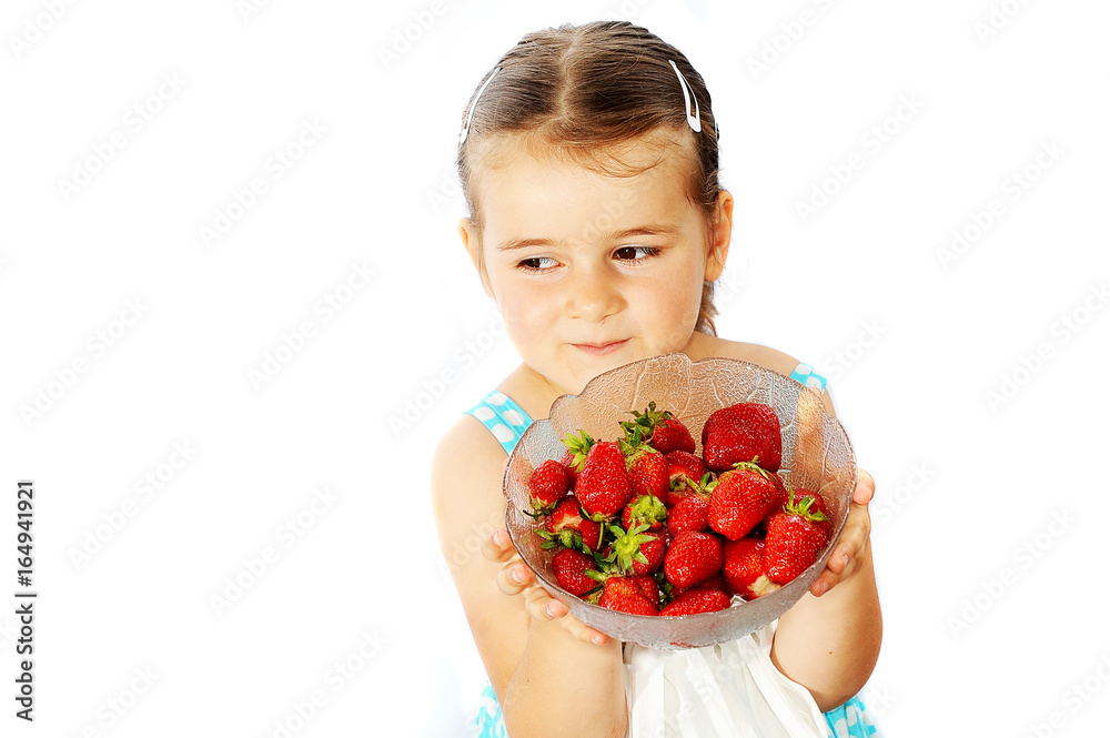 little cute child holding a strawberry, isolated on white little cute child holding a strawberry, isolated on white