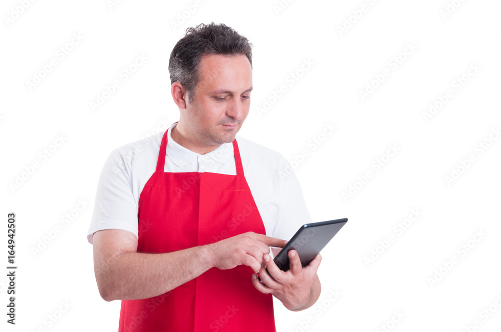 Young store supervisor with tablet pc in hand Young store supervisor with tablet pc in hand