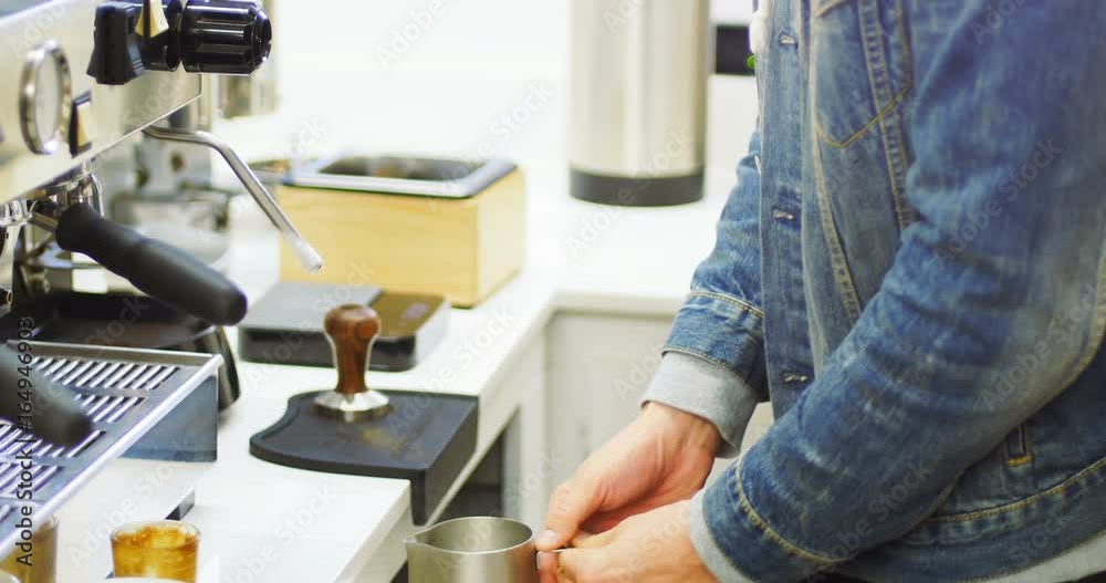 Mid section of man making cup of coffee in kitchen Mid section of man making cup of coffee in kitchen